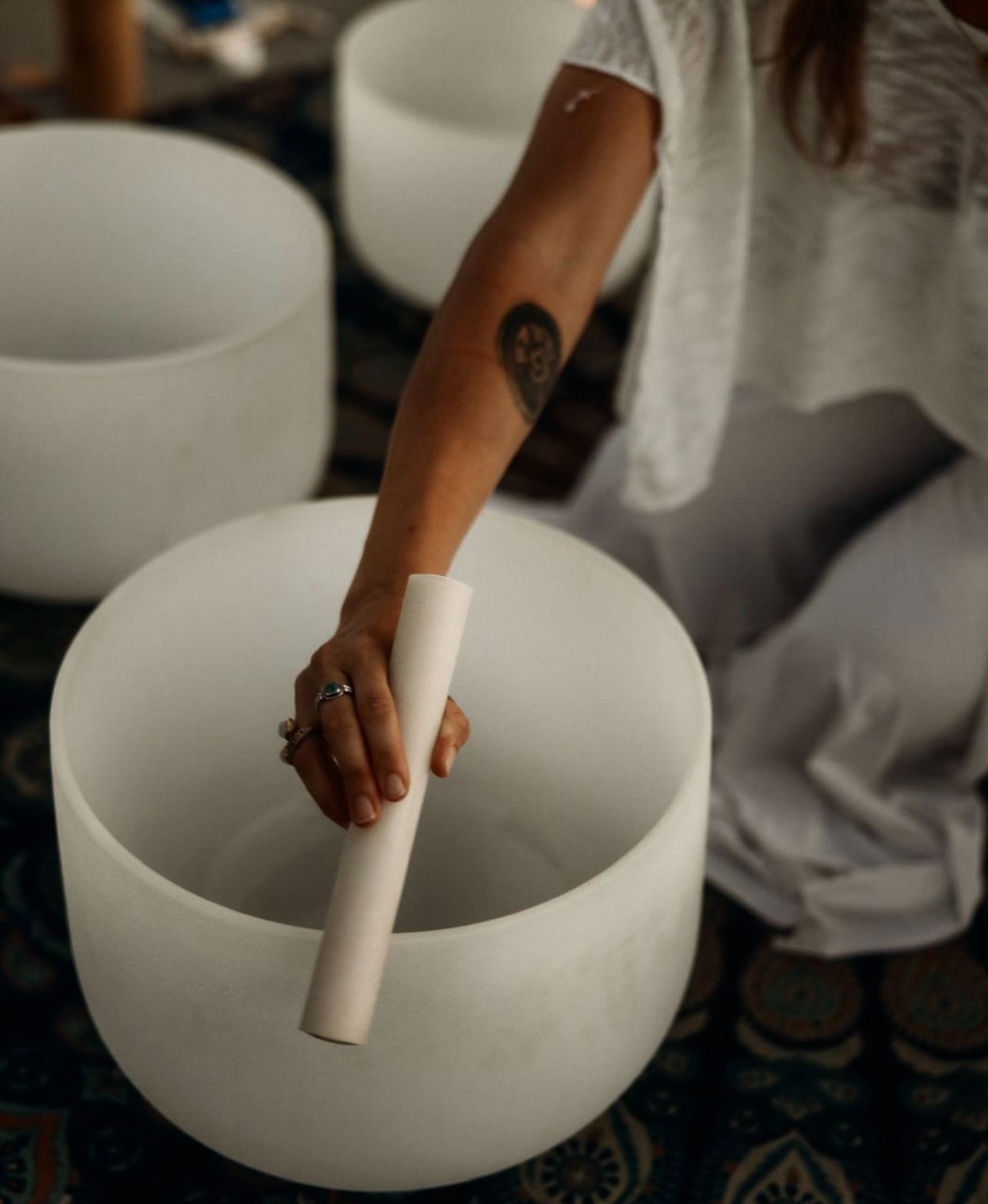 Kate playing a crystal singing bowl